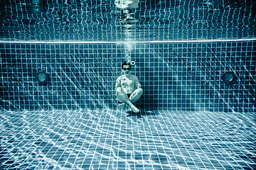 Image showing Persons lies under water in a swimming pool