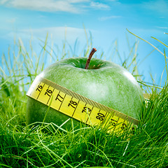 Image showing apple and measuring tape