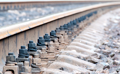 Image showing Closeup of rails and sleepers leaving afar