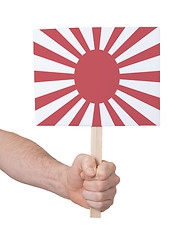 Image showing Hand holding small card - Flag of Japan