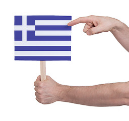 Image showing Hand holding small card - Flag of Greece