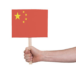 Image showing Hand holding small card - Flag of China