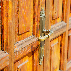 Image showing europe old in  italy  antique close brown door and rusty lock  c