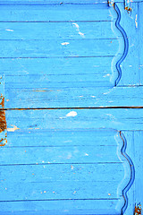 Image showing dirty stripped paint in  blue wood door  