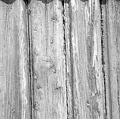 Image showing grain texture of a brown antique wooden old door in italy   euro