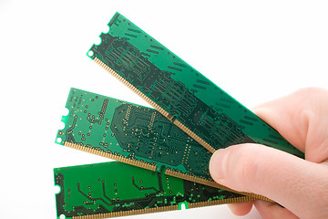 Image showing chips of memory in a hand. isolated