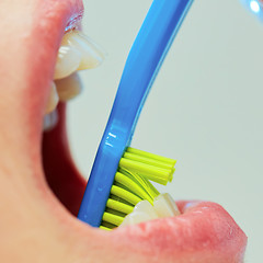 Image showing Dentist showing a woman how to brush her teeth