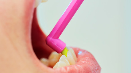 Image showing Dentist showing a woman how to brush her teeth