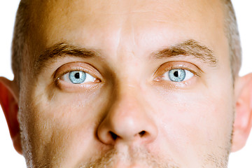 Image showing blue-eyed man. The face close up. Studio. isolated