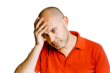 Image showing Unshaven middle-aged man holding his head. Headache. Studio. iso