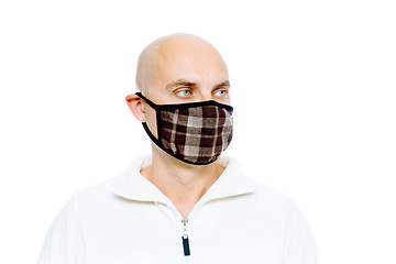 Image showing Bald, man in a white jacket and mask. Studio. isolated