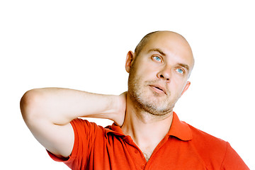 Image showing Unshaven middle-aged man holding his neck. Pain. Studio. isolate