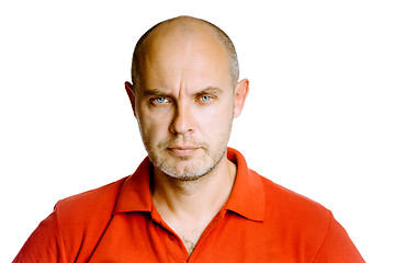 Image showing Unshaven fearsome middle-aged man in a red T-shirt. Studio. isol