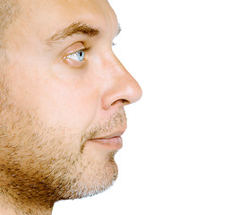 Image showing Unshaven blue eyed man in profile. Studio. isolated