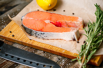 Image showing close up fresh steak salmon with knife