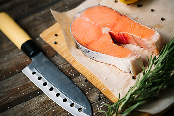 Image showing steak salmon on wooden cutting