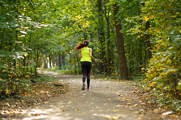 Image showing woman running at forest