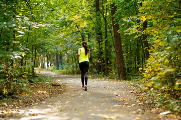 Image showing woman running at forest