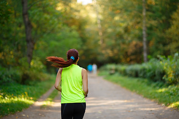 Image showing woman running at forest