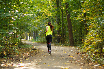 Image showing woman running at forest