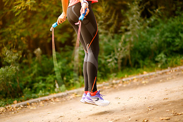 Image showing Close up of woman feet jumping in skipping rope