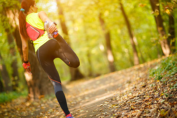 Image showing woman exercising and stretching muscles 