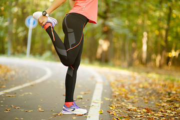 Image showing Detail of woman stretching legs 