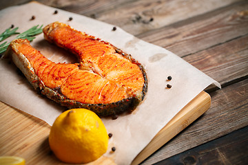 Image showing Grilled salmon on wooden table