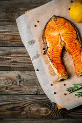 Image showing Grilled salmon on wooden table