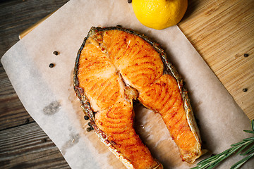 Image showing Grilled red fish steak salmon and lemon