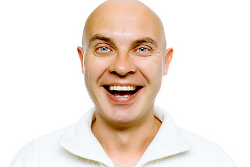 Image showing Bald smiling blue-eyed man. Studio. isolated