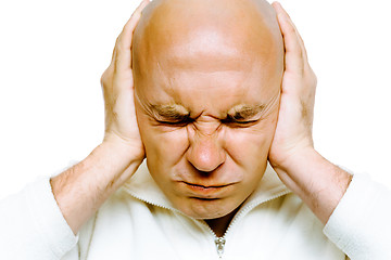 Image showing man closed his eyes and covered his ears with his hands. Studio.