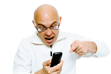 Image showing Bald man screaming into the phone. Studio. isolated