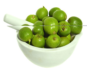 Image showing Green young walnuts in husks