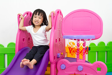 Image showing Asian Chinese little girl playing on the slide