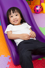 Image showing Asian Chinese little girl playing on the slide