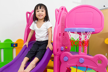 Image showing Asian Chinese little girl playing on the slide