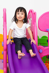 Image showing Asian Chinese little girl playing on the slide