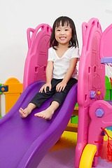 Image showing Asian Chinese little girl playing on the slide