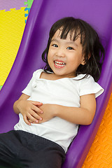 Image showing Asian Chinese little girl playing on the slide