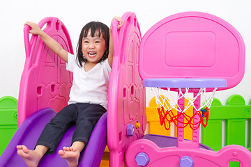 Image showing Asian Chinese little girl playing on the slide