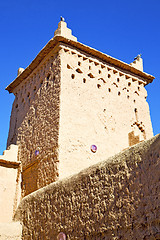 Image showing brown   construction in  africa  clouds  near the tower