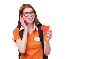 Image showing Girl student with cell phone holding credit card