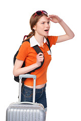 Image showing Smiling girl with backpack and suitcase