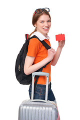 Image showing Smiling girl with backpack and suitcase