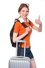 Image showing Smiling girl with backpack and suitcase