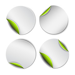 Image showing Set of white round stickers with green backside.