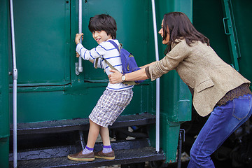 Image showing Boy traveler and mother