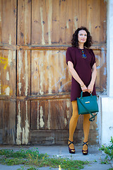 Image showing pretty woman in a burgundy dress