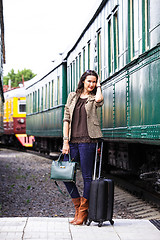 Image showing beautiful middle-aged woman with luggage